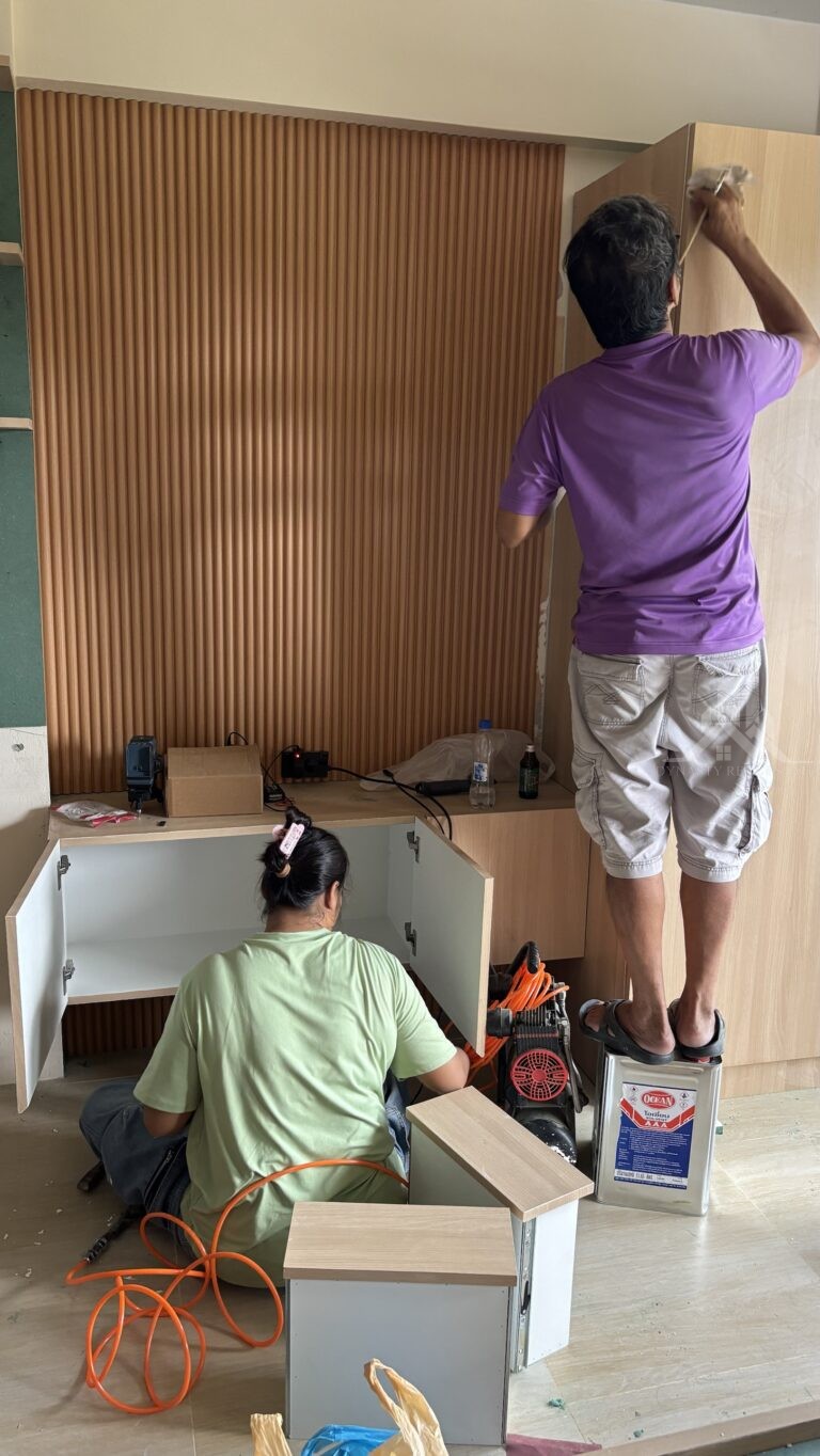 Fluted wood-slat feature wall and built-in storage at Chain Condominium, Jomtien